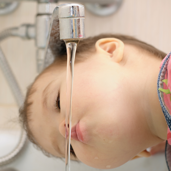 boy drinking tap water