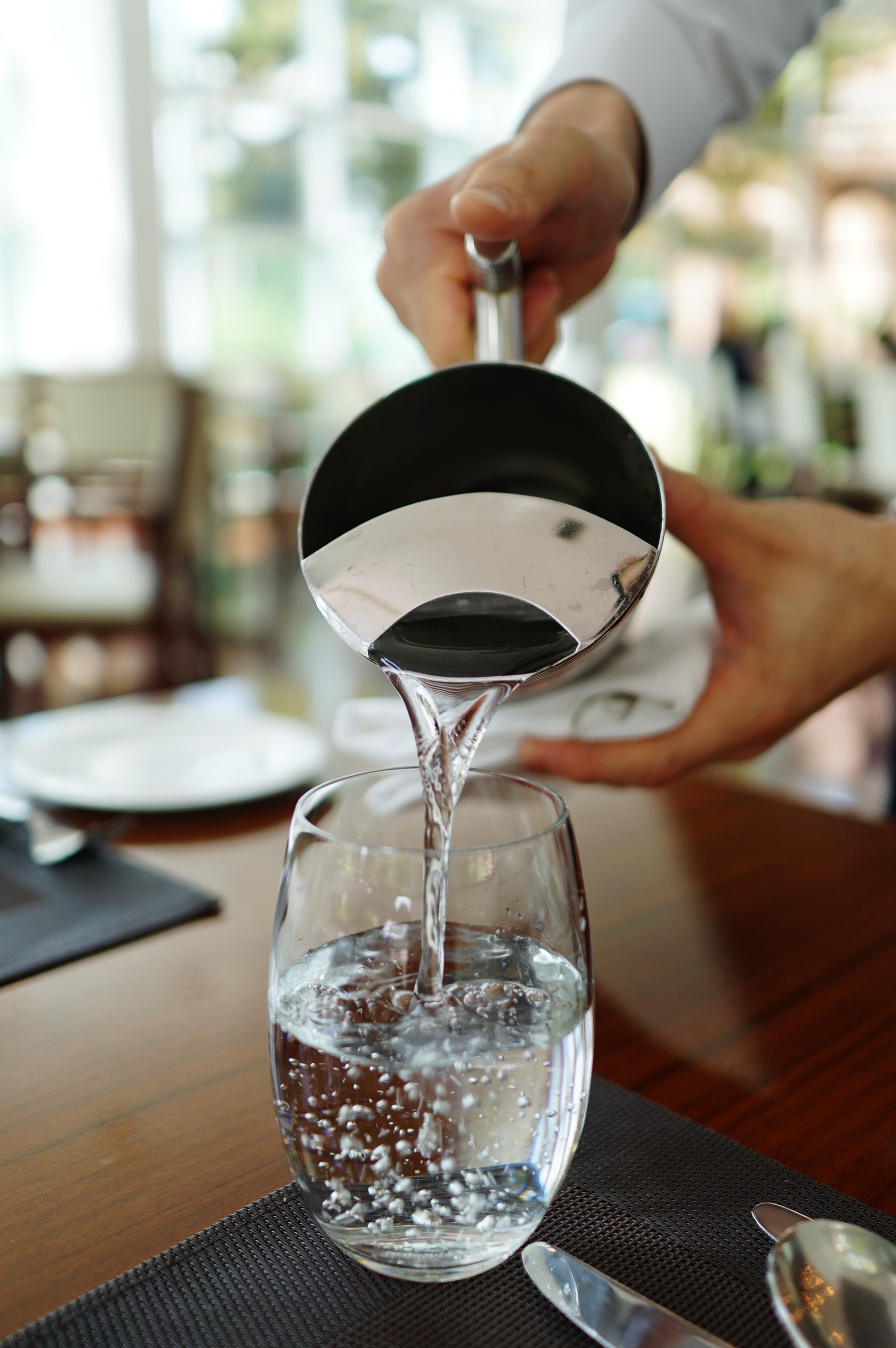 pouring water in a glass