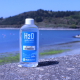 Sampling bottle, high water on the beach in the background